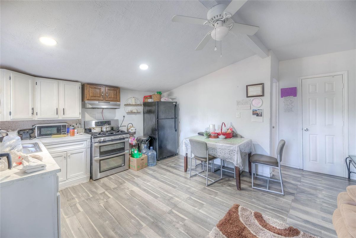 Dining room, Interior, Kitchen, Recessed Lighting, Stainless Steel Appliances, Wood Texture Flooring