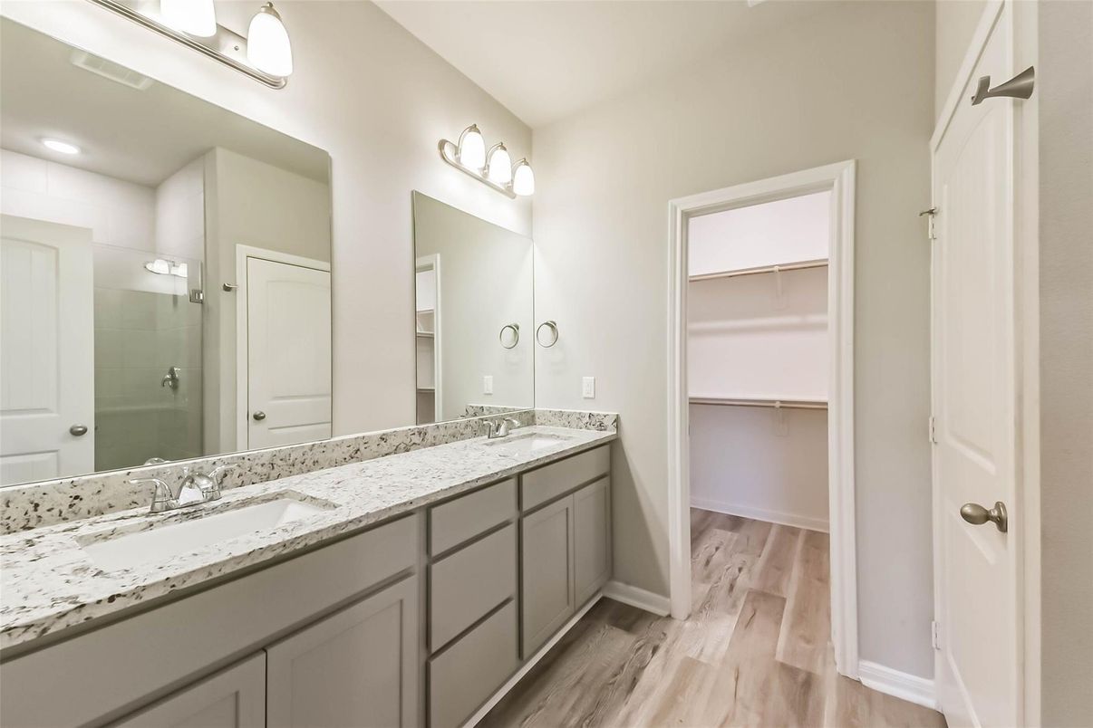 Bathroom, Dual Sink Vanities, Interior, Recessed Lighting, Walk-in Closets, Wood Texture Flooring
