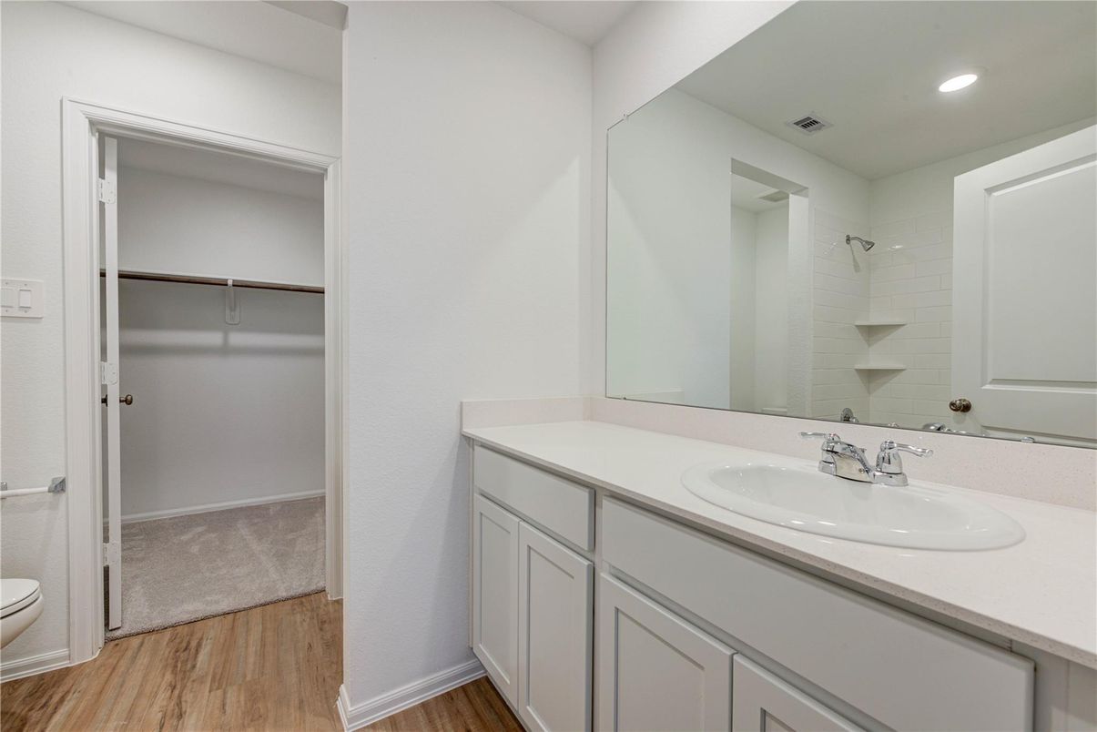Bathroom, Dual Sink Vanities, Interior, Recessed Lighting, Walk-in Closets, Wood Texture Flooring