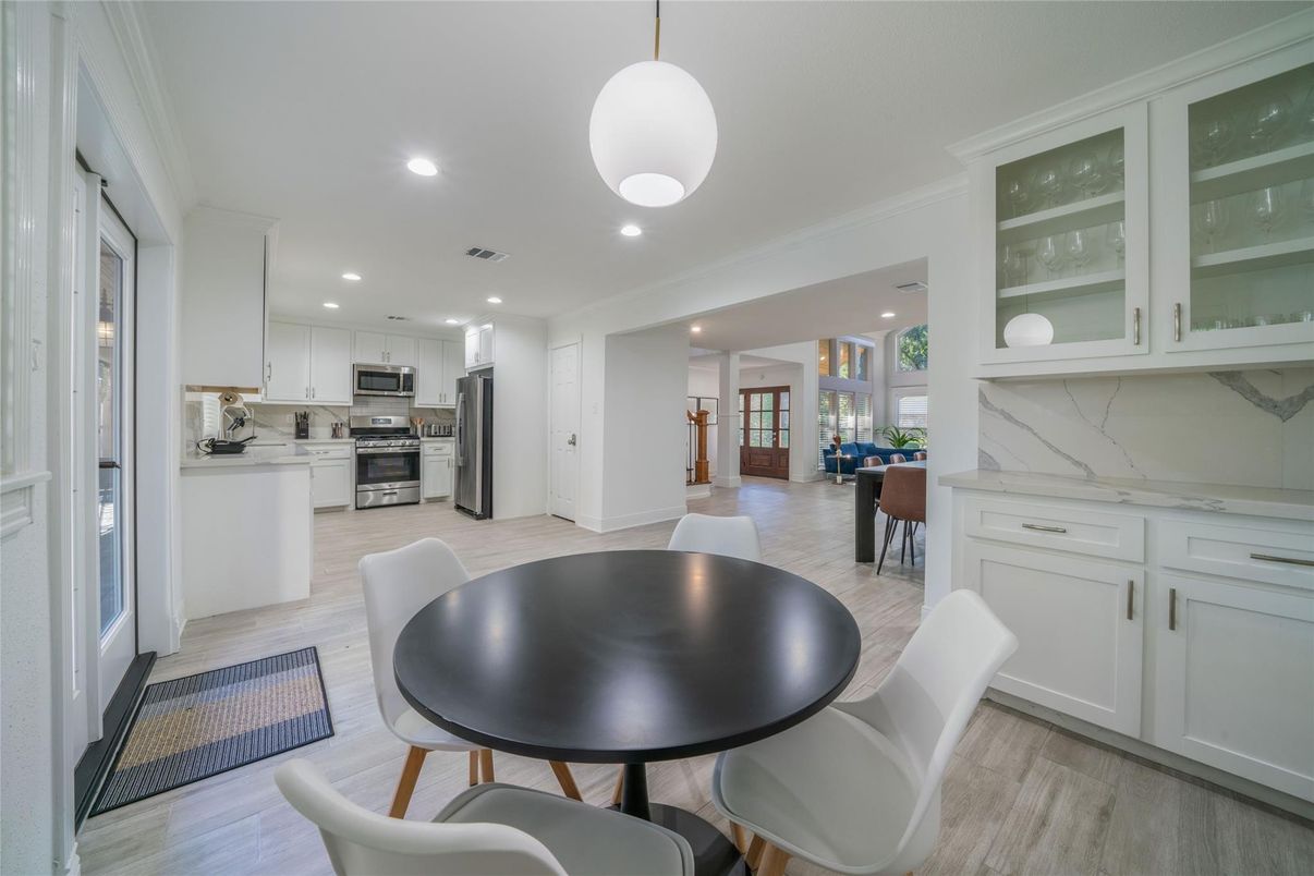 Dining room, Interior, Kitchen, Marble Walls, Pendant Lights, Recessed Lighting, Stainless Steel Appliances, Wood Texture Flooring