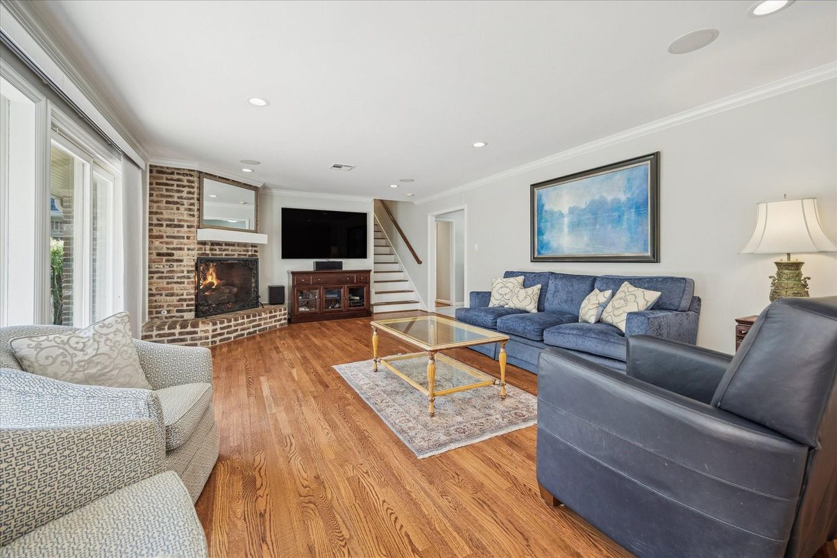 Fireplace, Interior, Living room, Recessed Lighting, Stone Walls, Wood Texture Flooring