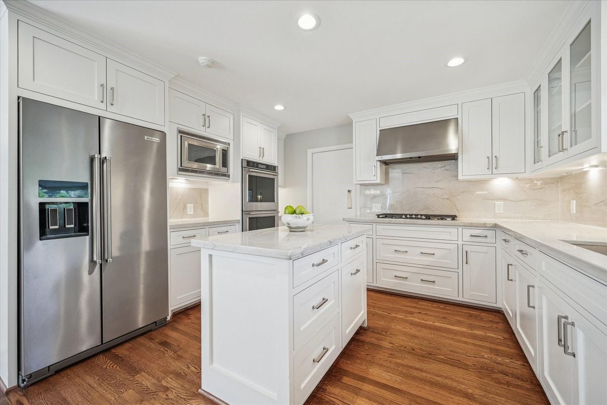 Interior, Kitchen, Marble Walls, Recessed Lighting, Stainless Steel Appliances, Wood Texture Flooring