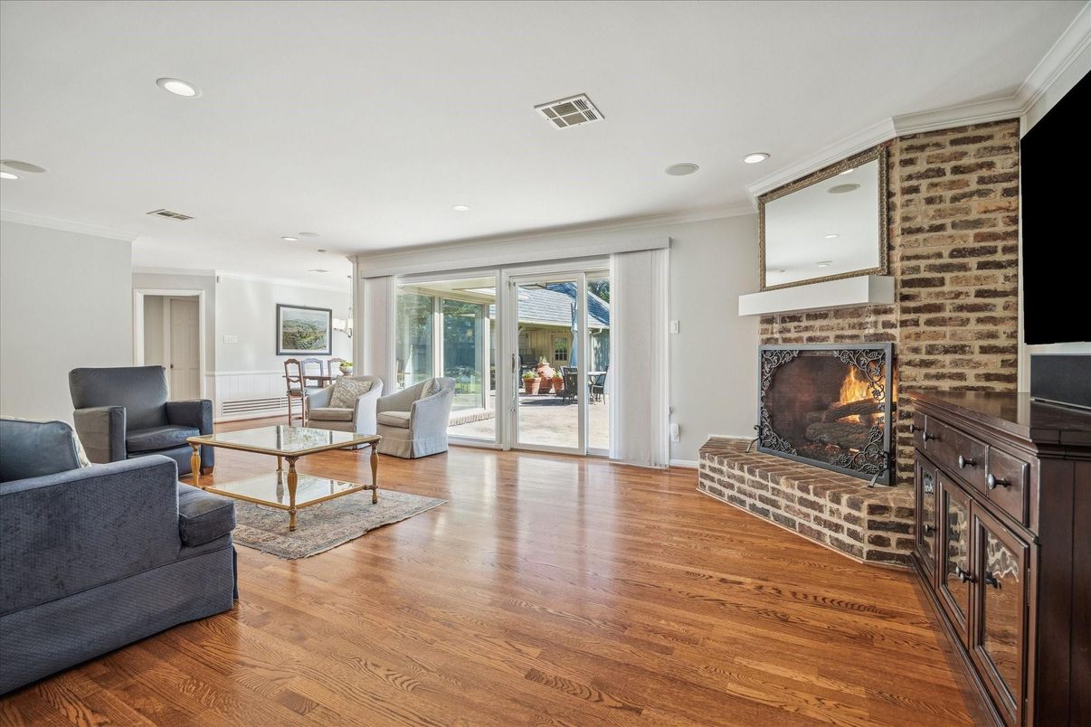 Fireplace, Interior, Living room, Recessed Lighting, Stone Walls, Wood Texture Flooring