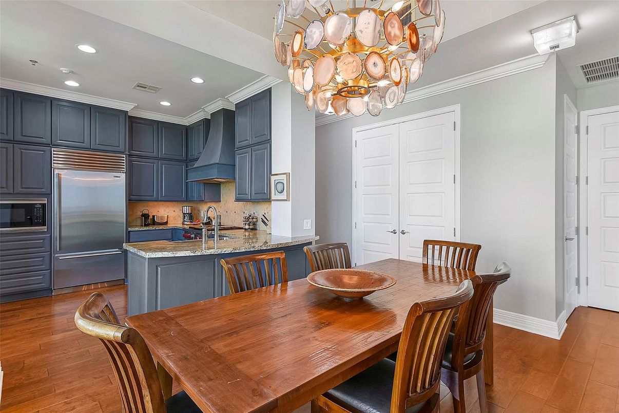 Chandelier, Dining room, Interior, Kitchen, Recessed Lighting, Stainless Steel Appliances, Wood Texture Flooring