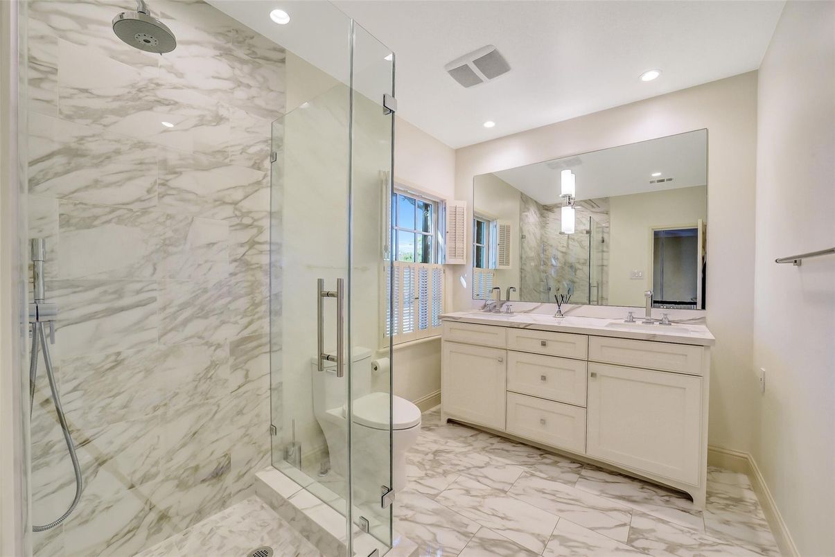 Bathroom, Dual Sink Vanities, Glass Shower, Interior, Marble, Marble Walls, Recessed Lighting