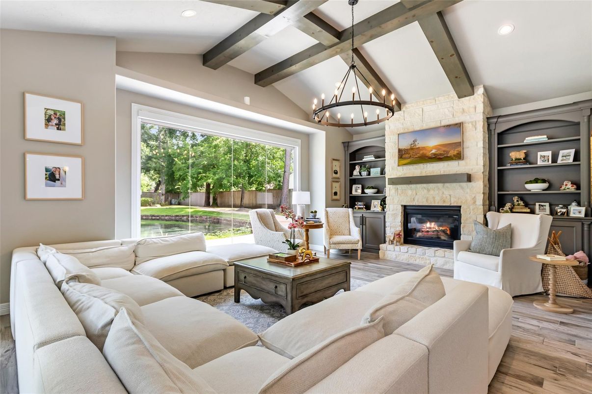 Chandelier, Fireplace, Interior, Living room, Recessed Lighting, Stone Walls, Wooden Beams, Wood Texture Flooring