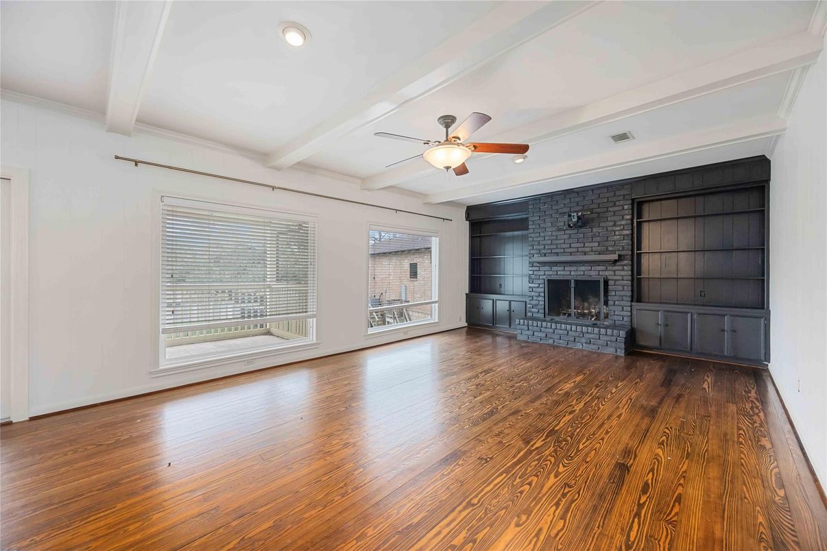 Empty room, Fireplace, Interior, Recessed Lighting, Stone Walls, Wood Texture Flooring
