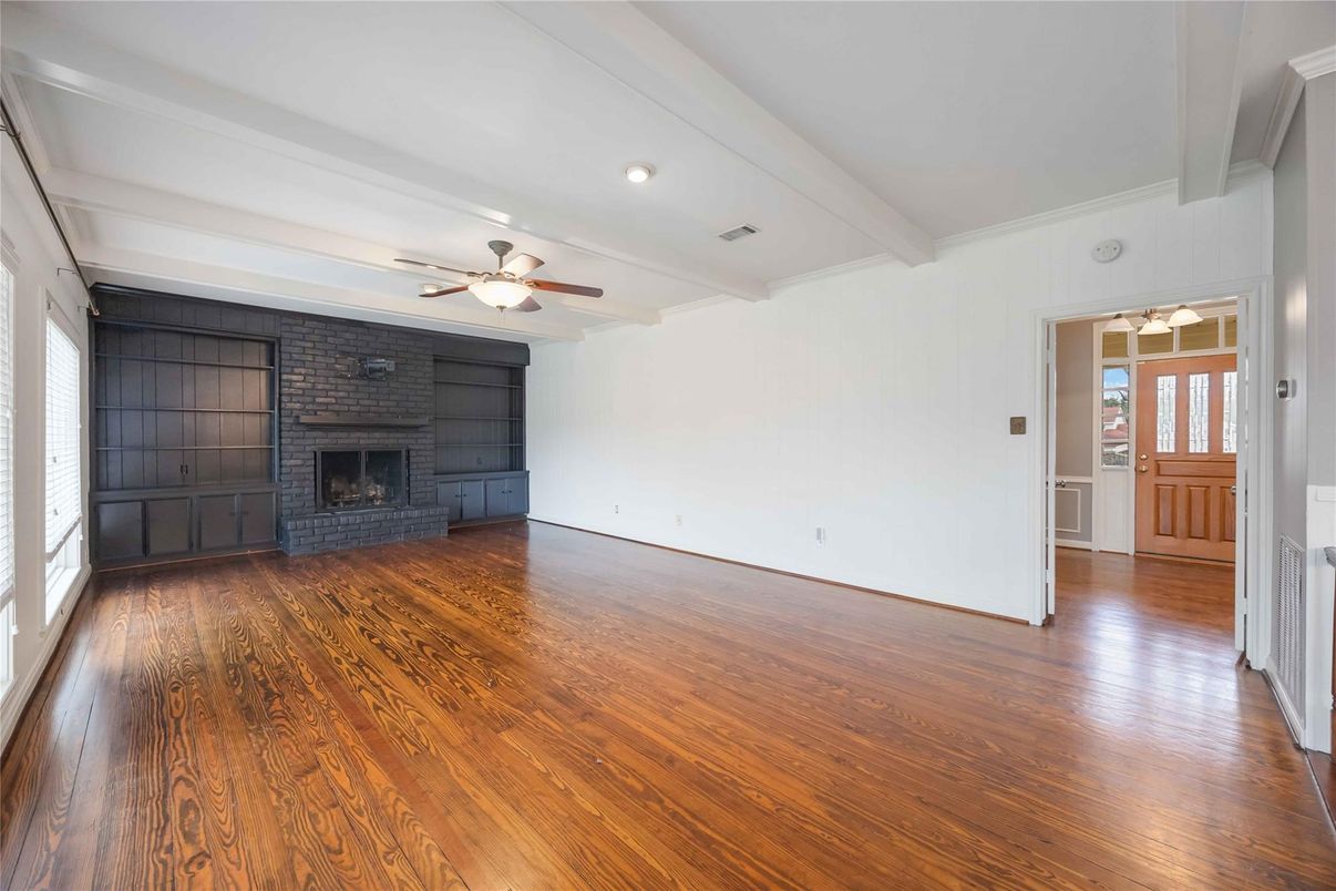 Empty room, Fireplace, Interior, Recessed Lighting, Stone Walls, Wood Texture Flooring