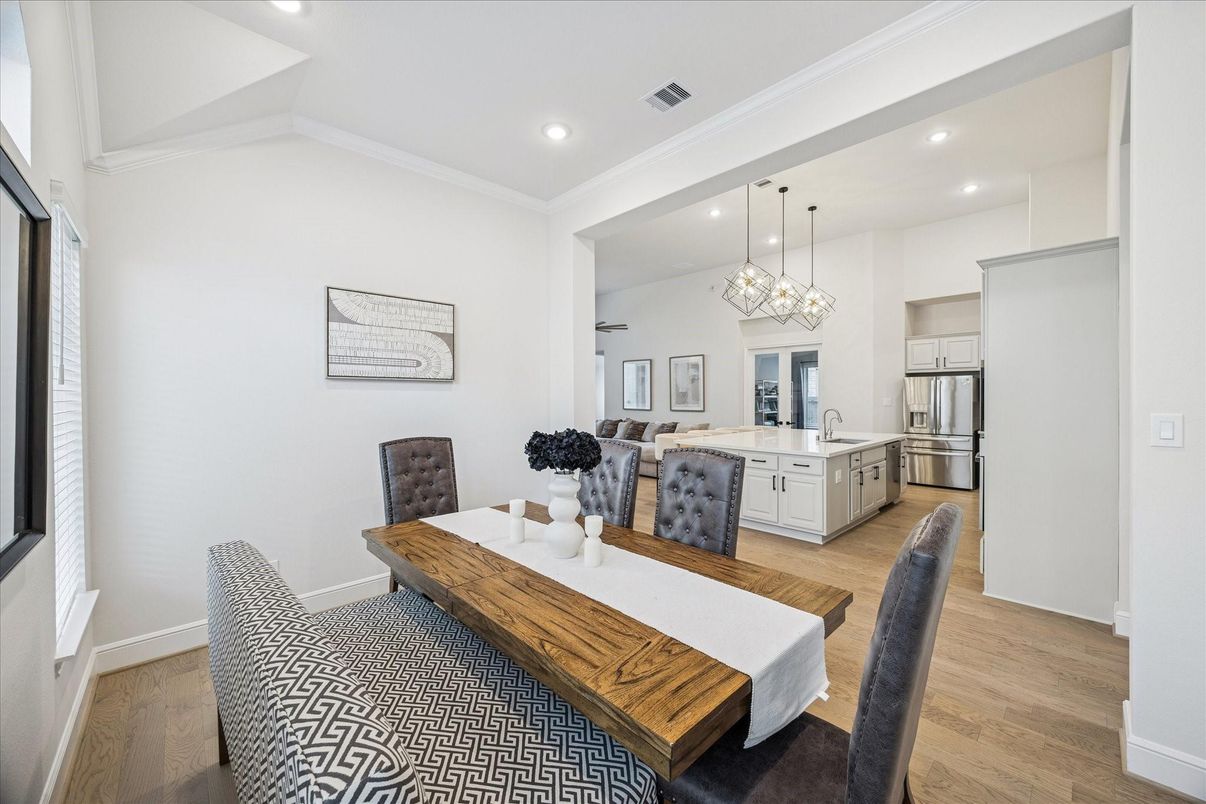 Dining room, Interior, Kitchen, Pendant Lights, Recessed Lighting, Stainless Steel Appliances, Wood Texture Flooring