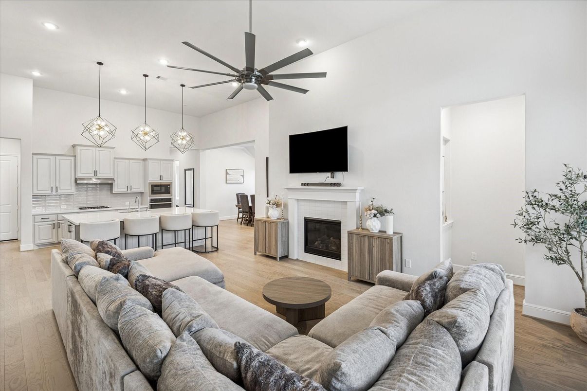 Fireplace, Interior, Kitchen, Living room, Pendant Lights, Recessed Lighting, Stainless Steel Appliances, Wood Texture Flooring