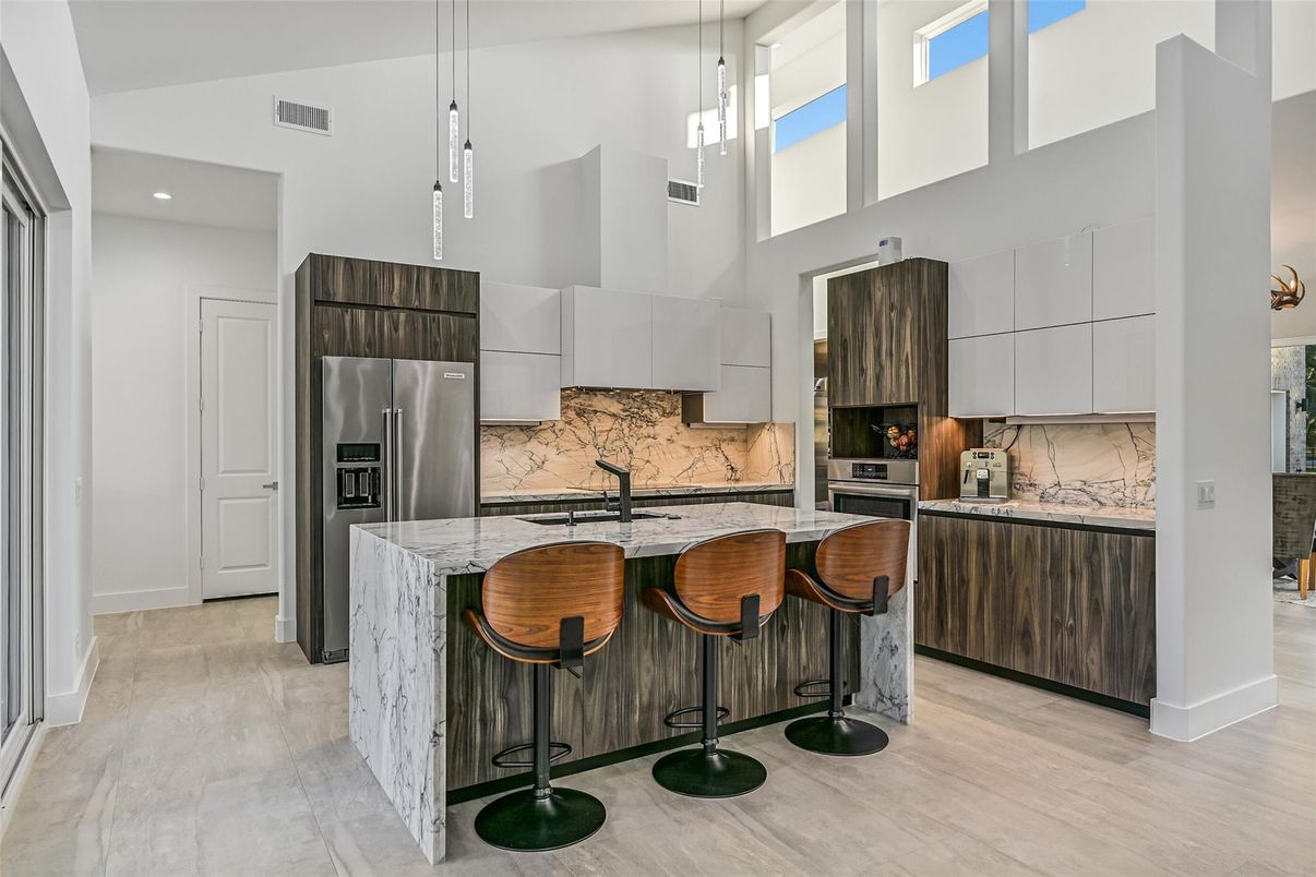 Interior, Kitchen, Marble Walls, Pendant Lights, Recessed Lighting, Stainless Steel Appliances, Wood Texture Flooring