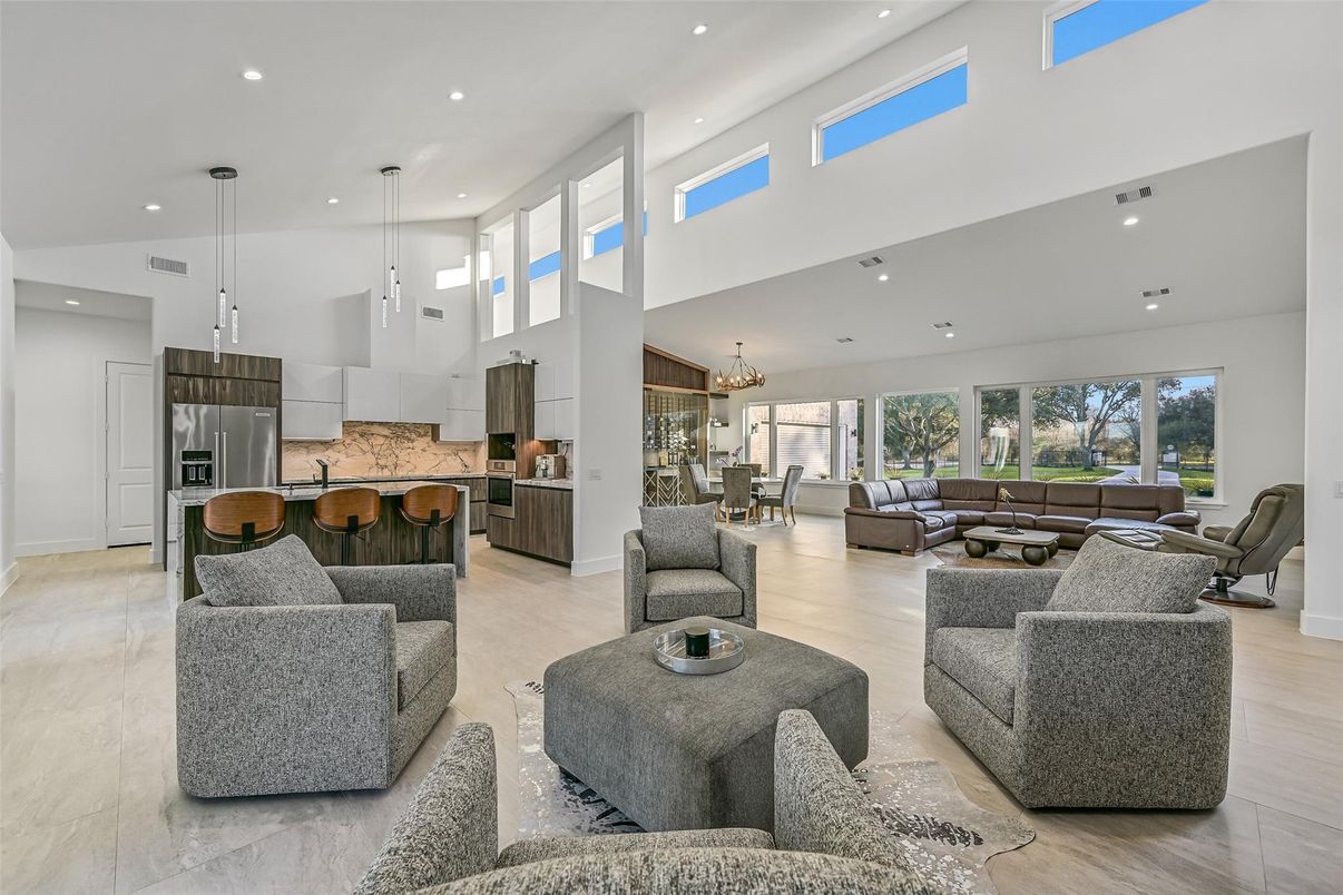 Chandelier, Dining room, Interior, Kitchen, Living room, Pendant Lights, Recessed Lighting, Stainless Steel Appliances, Wood Texture Flooring