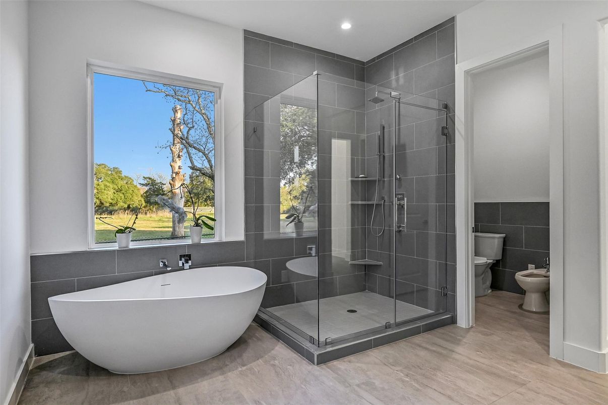 Bathroom, Free Standing Baths, Glass Shower, Interior, Recessed Lighting, Wood Texture Flooring