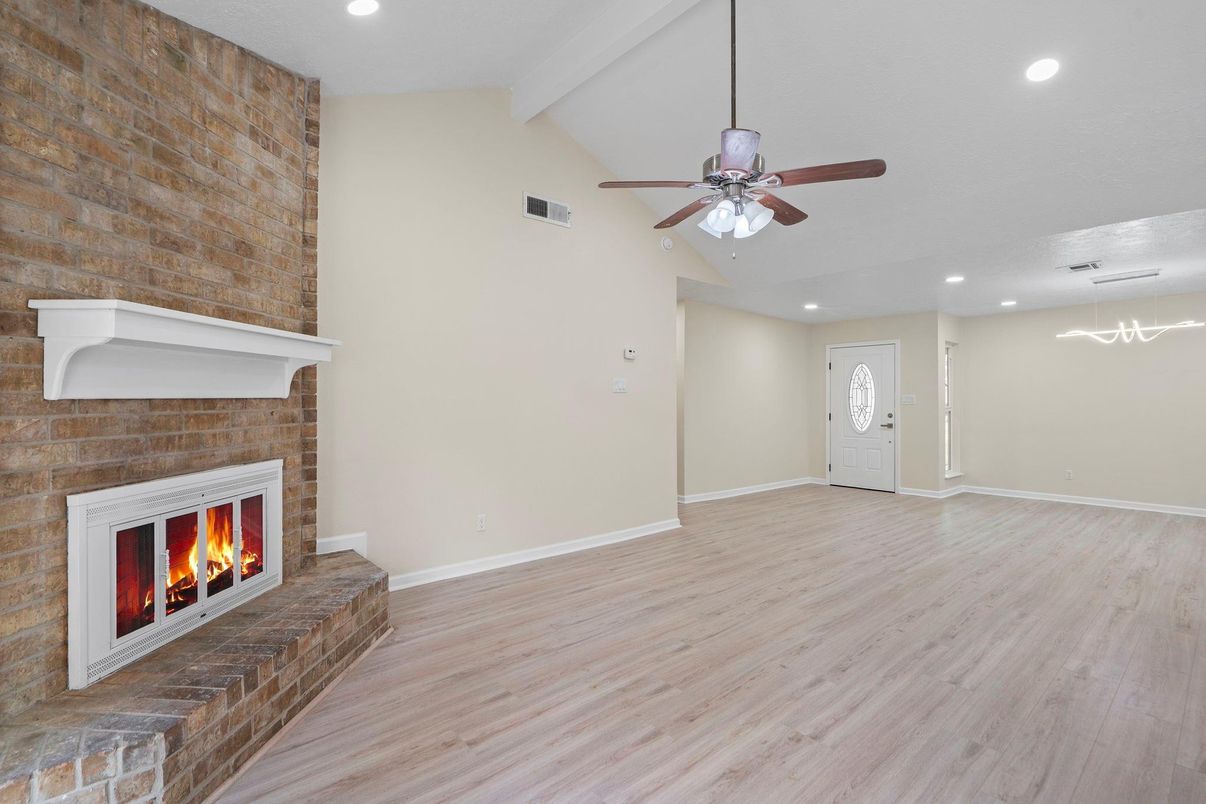 Empty room, Fireplace, Interior, Pendant Lights, Recessed Lighting, Stone Walls, Wood Texture Flooring