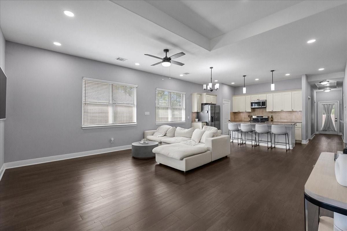 Chandelier, Interior, Kitchen, Living room, Pendant Lights, Recessed Lighting, Stainless Steel Appliances, Wood Texture Flooring