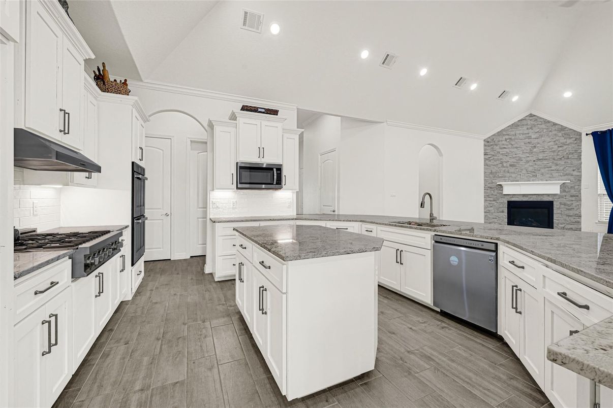 Fireplace, Interior, Kitchen, Recessed Lighting, Stone Walls, Wood Texture Flooring