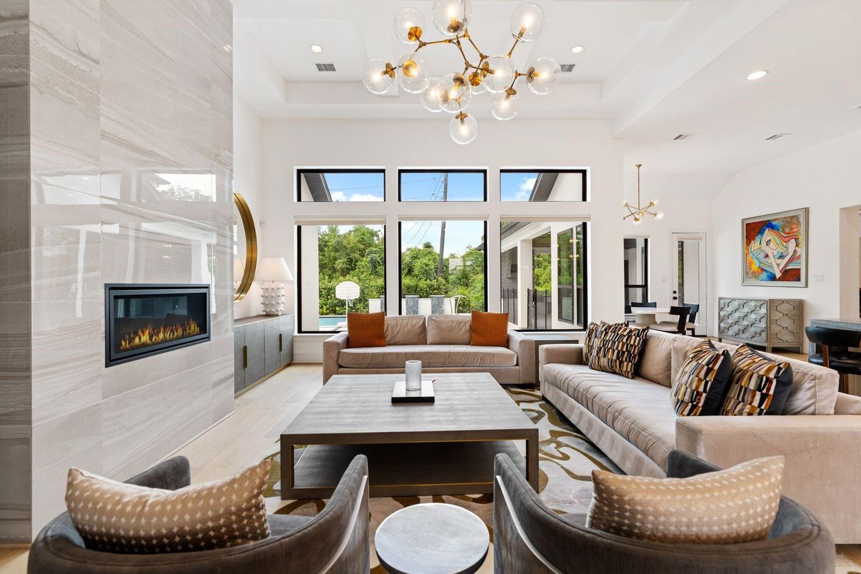 Dining room, Fireplace, Interior, Living room, Pendant Lights, Recessed Lighting, Wood Texture Flooring