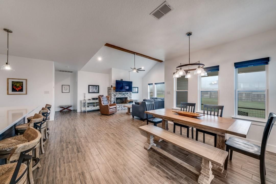 Dining room, Fireplace, Interior, Living room, Pendant Lights, Recessed Lighting, Wood Texture Flooring