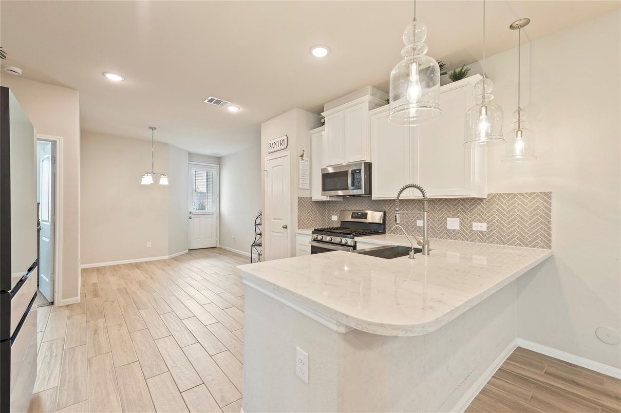 Interior, Kitchen, Pendant Lights, Recessed Lighting, Stainless Steel Appliances, Wood Texture Flooring