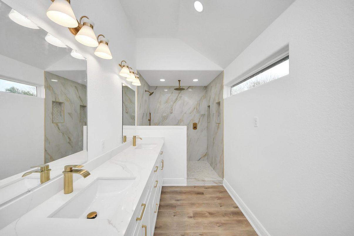 Bathroom, Dual Sink Vanities, Glass Shower, Interior, Marble Walls, Recessed Lighting, Wood Texture Flooring