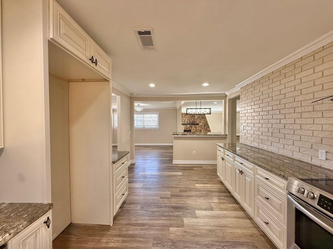 Interior, Kitchen, Pendant Lights, Recessed Lighting, Stainless Steel Appliances, Stone Walls, Wood Texture Flooring