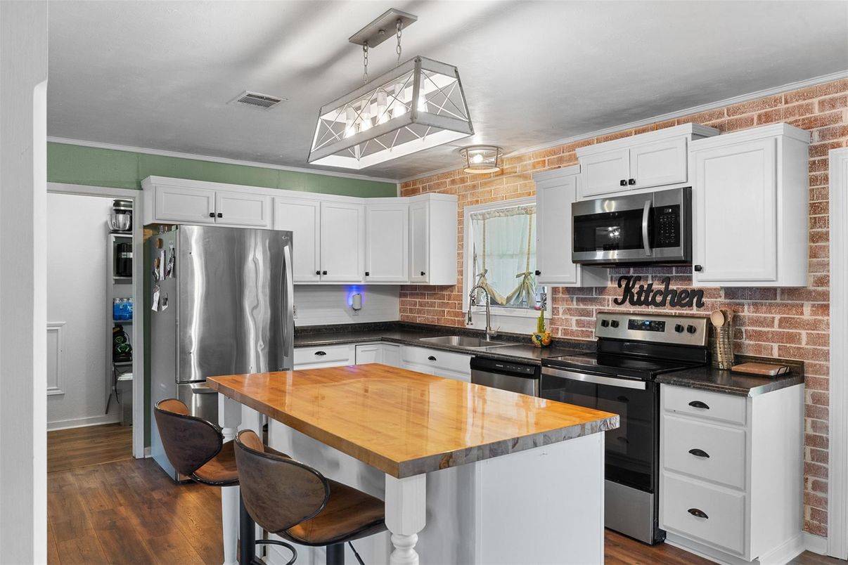 Interior, Kitchen, Pendant Lights, Stainless Steel Appliances, Stone Walls, Wood Texture Flooring