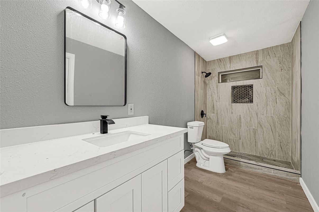 Bathroom, Glass Shower, Interior, Marble Walls, Wood Texture Flooring