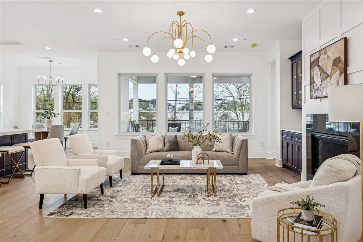 Chandelier, Dining room, Fireplace, Interior, Living room, Pendant Lights, Recessed Lighting, Wood Texture Flooring