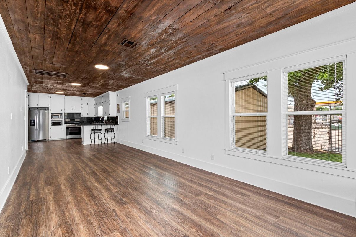 Empty room, Interior, Kitchen, Recessed Lighting, Stainless Steel Appliances, Wooden Ceilings, Wood Texture Flooring