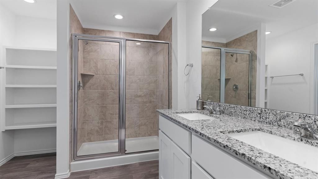 Bathroom, Dual Sink Vanities, Glass Shower, Interior, Recessed Lighting, Wood Texture Flooring