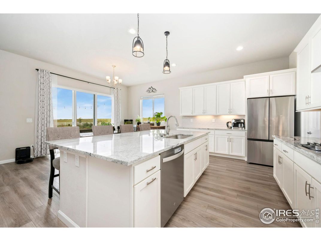 Chandelier, Interior, Kitchen, Pendant Lights, Recessed Lighting, Stainless Steel Appliances, Wood Texture Flooring