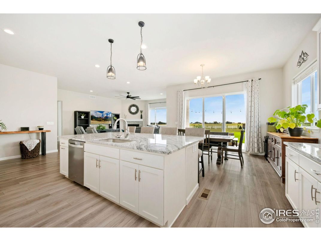 Chandelier, Dining room, Interior, Kitchen, Pendant Lights, Recessed Lighting, Stainless Steel Appliances, Wood Texture Flooring