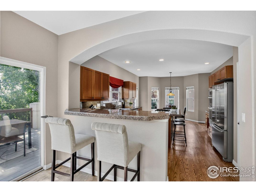 Dining room, Interior, Kitchen, Pendant Lights, Recessed Lighting, Stainless Steel Appliances, Wood Texture Flooring