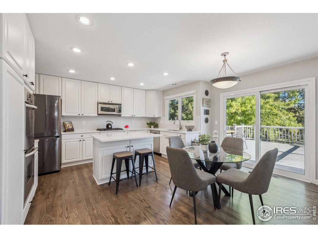 Dining room, Interior, Kitchen, Pendant Lights, Recessed Lighting, Stainless Steel Appliances, Wood Texture Flooring