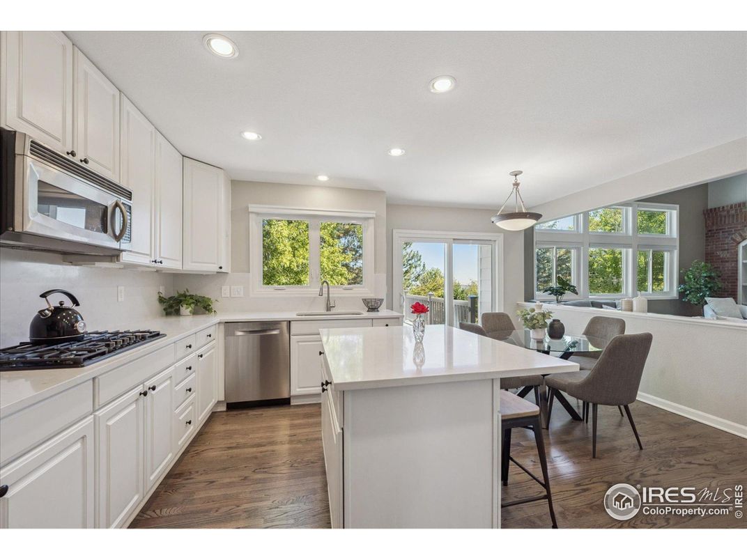 Dining room, Interior, Kitchen, Pendant Lights, Recessed Lighting, Stainless Steel Appliances, Wood Texture Flooring