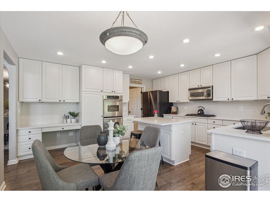Dining room, Interior, Kitchen, Recessed Lighting, Stainless Steel Appliances, Wood Texture Flooring