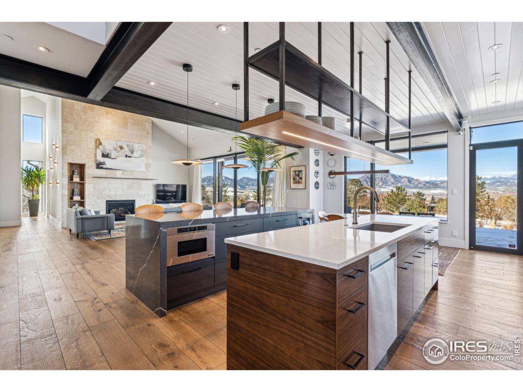 Fireplace, Interior, Kitchen, Living room, Pendant Lights, Recessed Lighting, Stainless Steel Appliances, Stone Walls, Wooden Beams, Wood Texture Flooring
