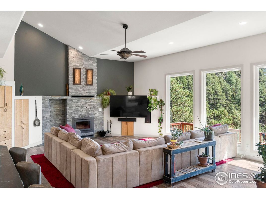 Fireplace, Interior, Living room, Recessed Lighting, Stone Walls, Wood Texture Flooring
