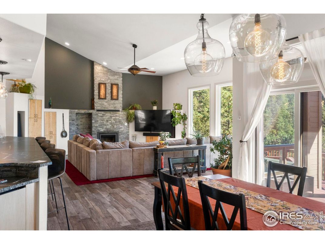 Dining room, Fireplace, Interior, Living room, Pendant Lights, Recessed Lighting, Stone Walls, Wood Texture Flooring