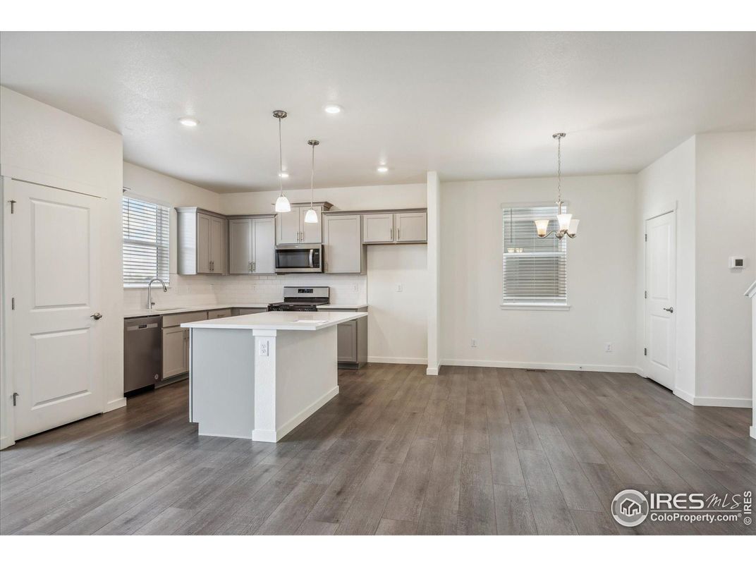 Chandelier, Interior, Kitchen, Pendant Lights, Recessed Lighting, Stainless Steel Appliances, Wood Texture Flooring