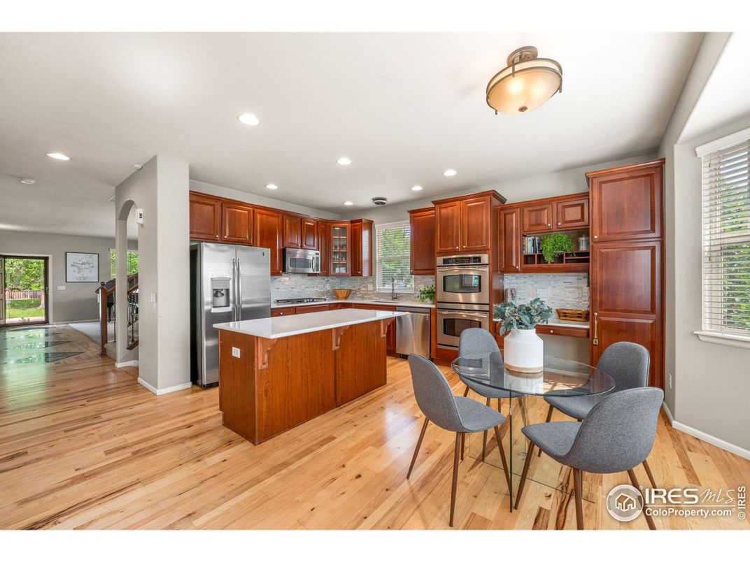 Dining room, Interior, Kitchen, Recessed Lighting, Stainless Steel Appliances, Wood Texture Flooring