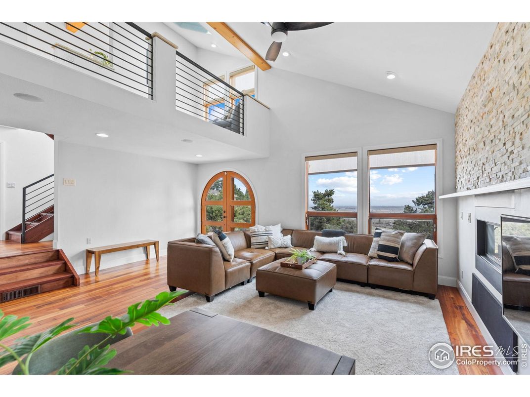 Fireplace, Interior, Living room, Recessed Lighting, Stone Walls, Water, Wood Texture Flooring