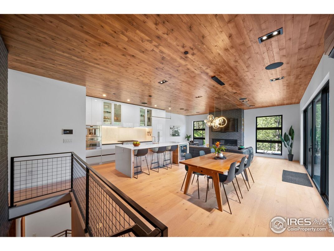 Dining room, Fireplace, Interior, Kitchen, Pendant Lights, Recessed Lighting, Stainless Steel Appliances, Wooden Ceilings, Wood Texture Flooring