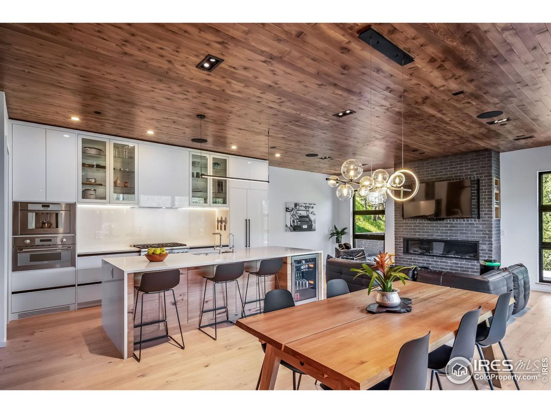 Dining room, Fireplace, Interior, Kitchen, Pendant Lights, Recessed Lighting, Stone Walls, Wooden Ceilings, Wood Texture Flooring