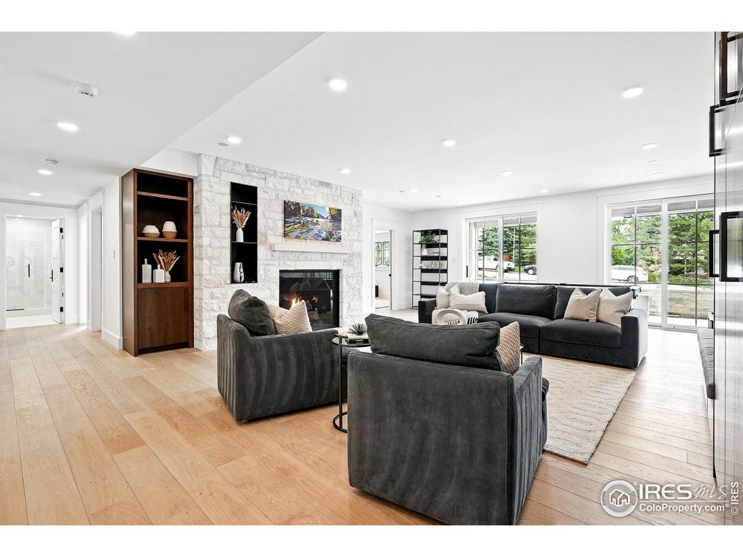 Fireplace, Interior, Living room, Recessed Lighting, Stone Walls, Wood Texture Flooring