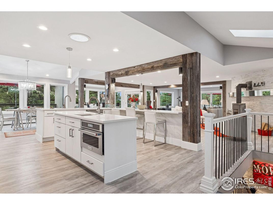 Chandelier, Dining room, Interior, Kitchen, Pendant Lights, Recessed Lighting, Stainless Steel Appliances, Wood Texture Flooring