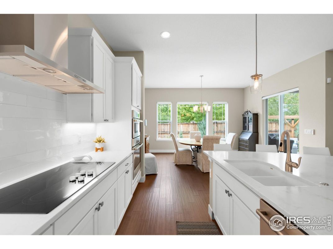 Dining room, Interior, Kitchen, Pendant Lights, Recessed Lighting, Stainless Steel Appliances, Wood Texture Flooring