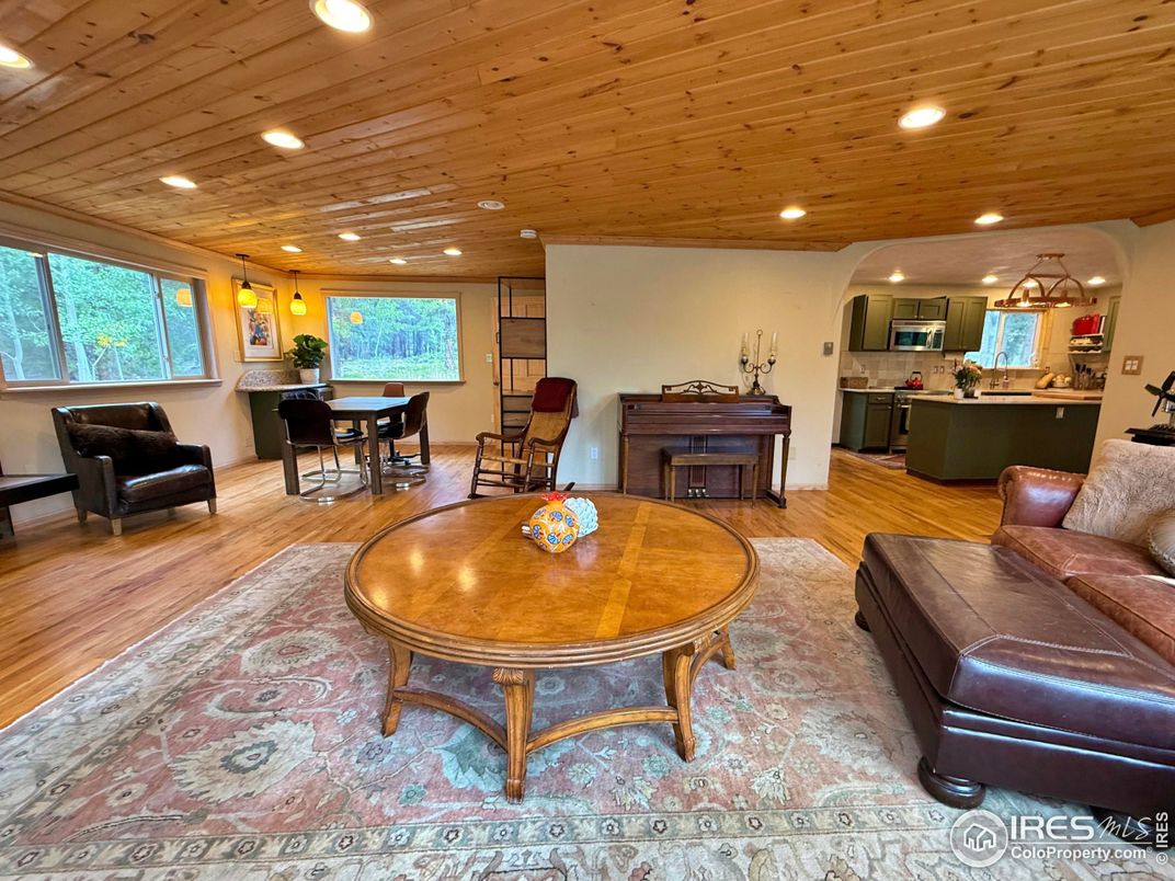 Dining room, Interior, Kitchen, Living room, Pendant Lights, Piano, Recessed Lighting, Wooden Ceilings, Wood Texture Flooring