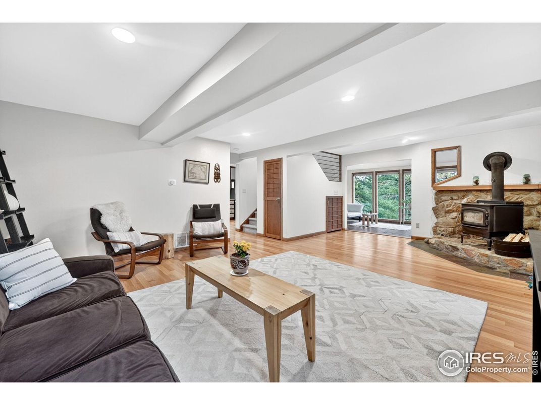 Fireplace, Interior, Living room, Recessed Lighting, Stone Walls, Wood Texture Flooring