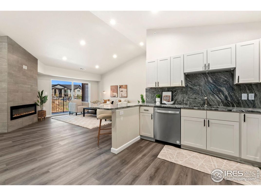 Dining room, Fireplace, Interior, Kitchen, Recessed Lighting, Stone Walls, Wood Texture Flooring